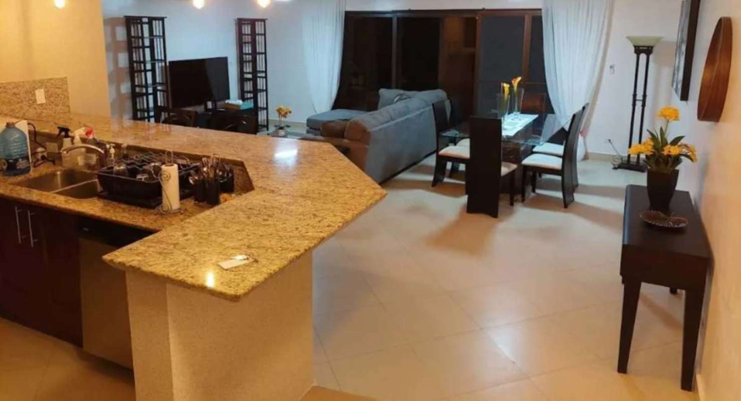 Bright open living dining room with garden views Embassy Club Clayton Panama