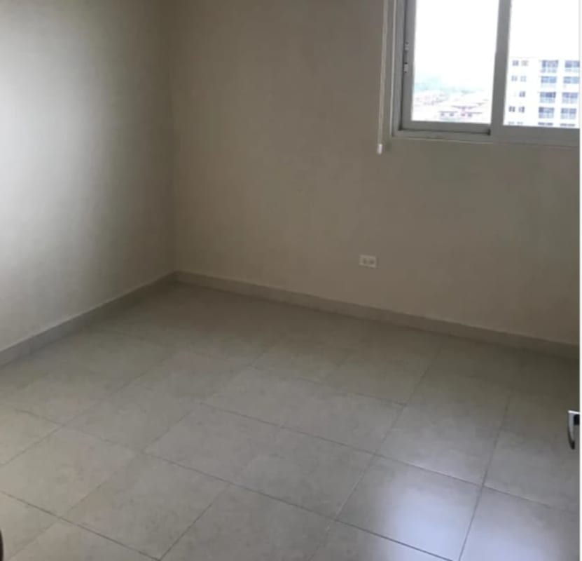 Vacant bedroom with tiled floors in Costa Sur apartment Panama