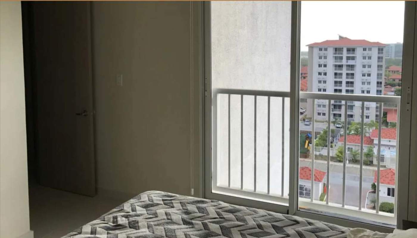 Bedroom featuring sliding glass door to balcony in Versalles III Panama