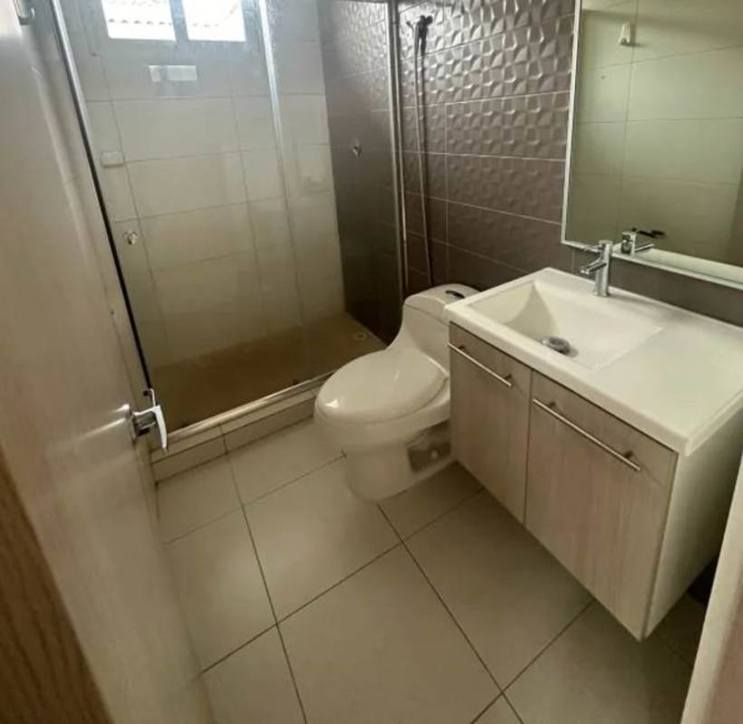 Contemporary bathroom with glass shower and vanity in Torres de Versalles Panama