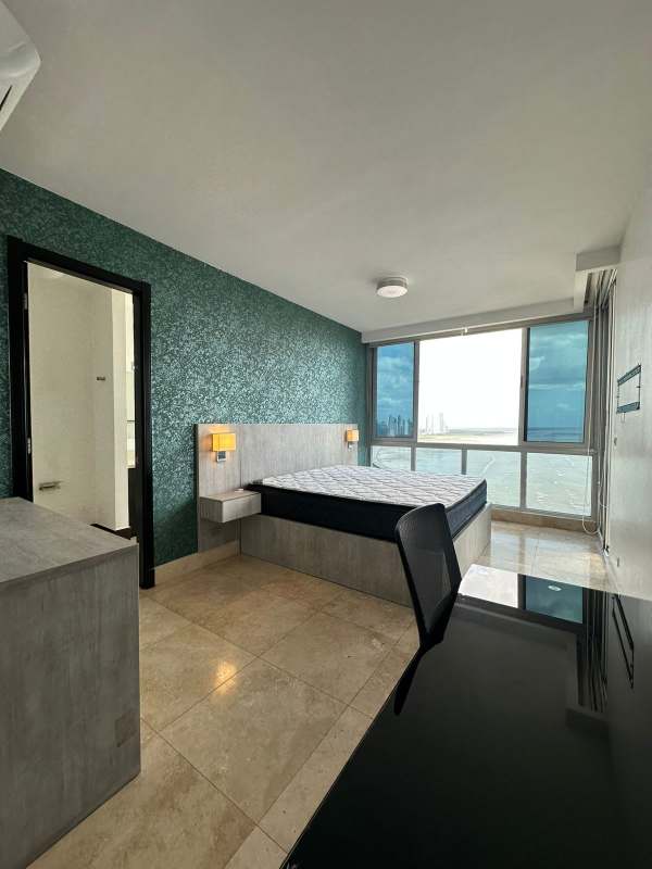 Bedroom with large windows, ocean views, minimalist style PH Coco del Mar