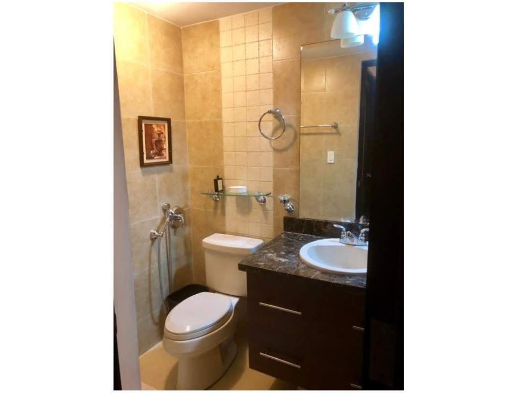 Bathroom with marble countertop, wall mirror, and modern fixtures PH Clayton Park Clayton Panama