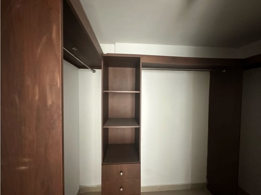 Walk-in closet with organized shelves, drawers, hanging space in PH Portofino San Francisco