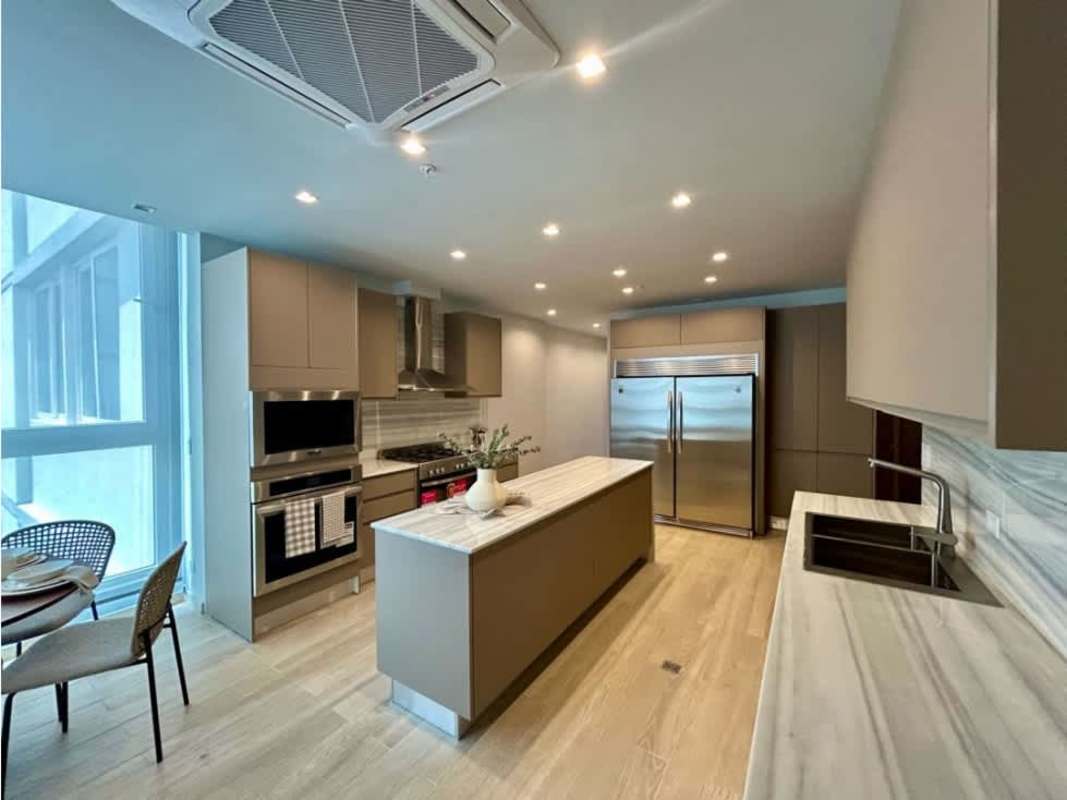 Gourmet kitchen with marble countertops and premium appliances at The Towers Punta Paitilla Panama