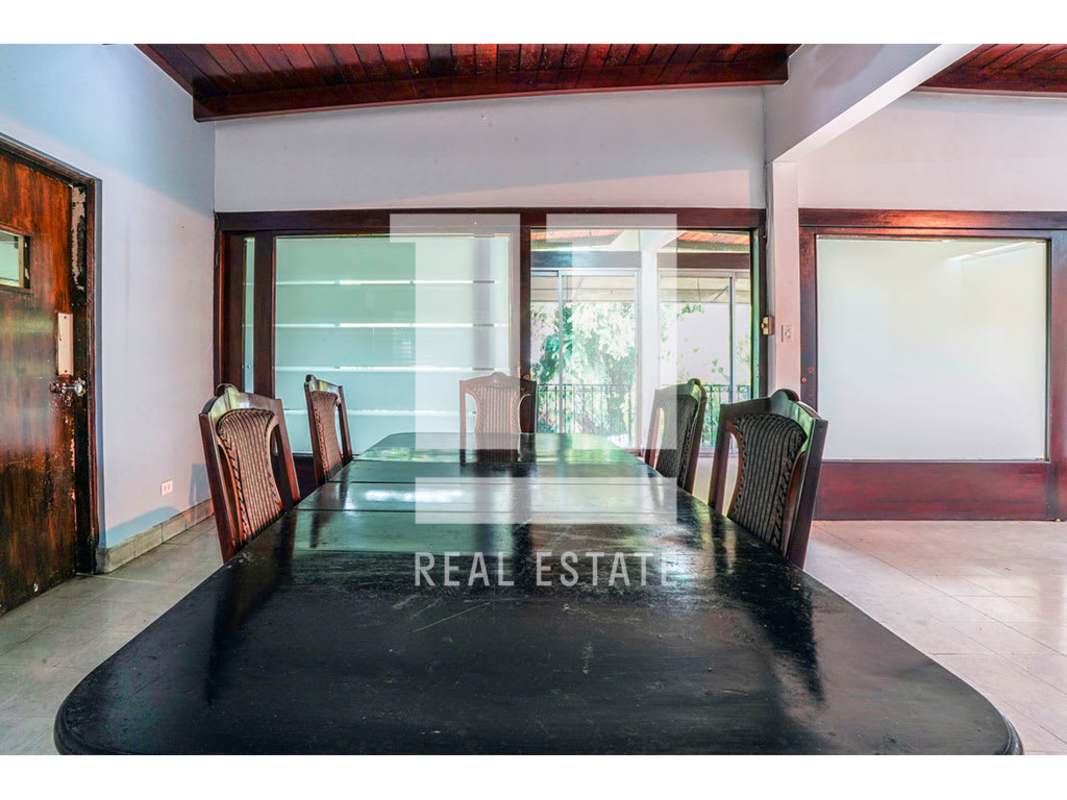 Private office or bedroom with laminate wood floors and AC in Via Porras commercial house Panama