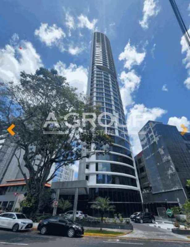 Modern high-rise tower with glass facade and rounded corner design in Obarrio Panama City - PH Denovo