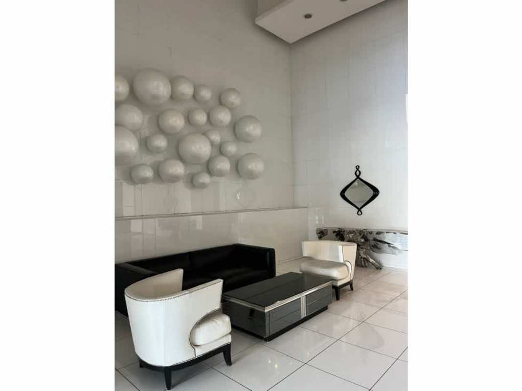 Spacious master bedroom with large window and ocean views in PH White Tower Avenida Balboa Panama