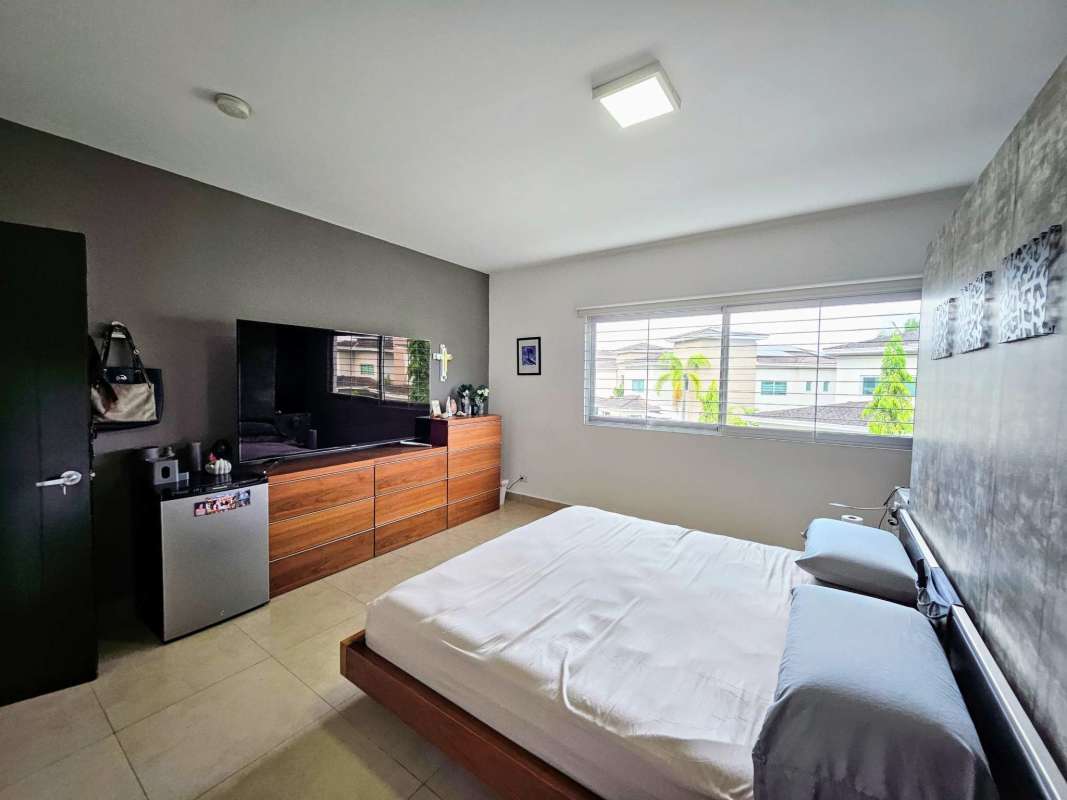 Spacious master bedroom with split AC ensuite bathroom and window in Panama house
