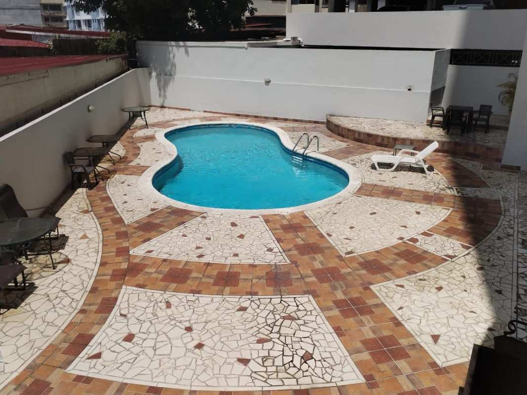 Outdoor swimming pool with sun deck and patio furniture PH Aurora Tower El Cangrejo Panama