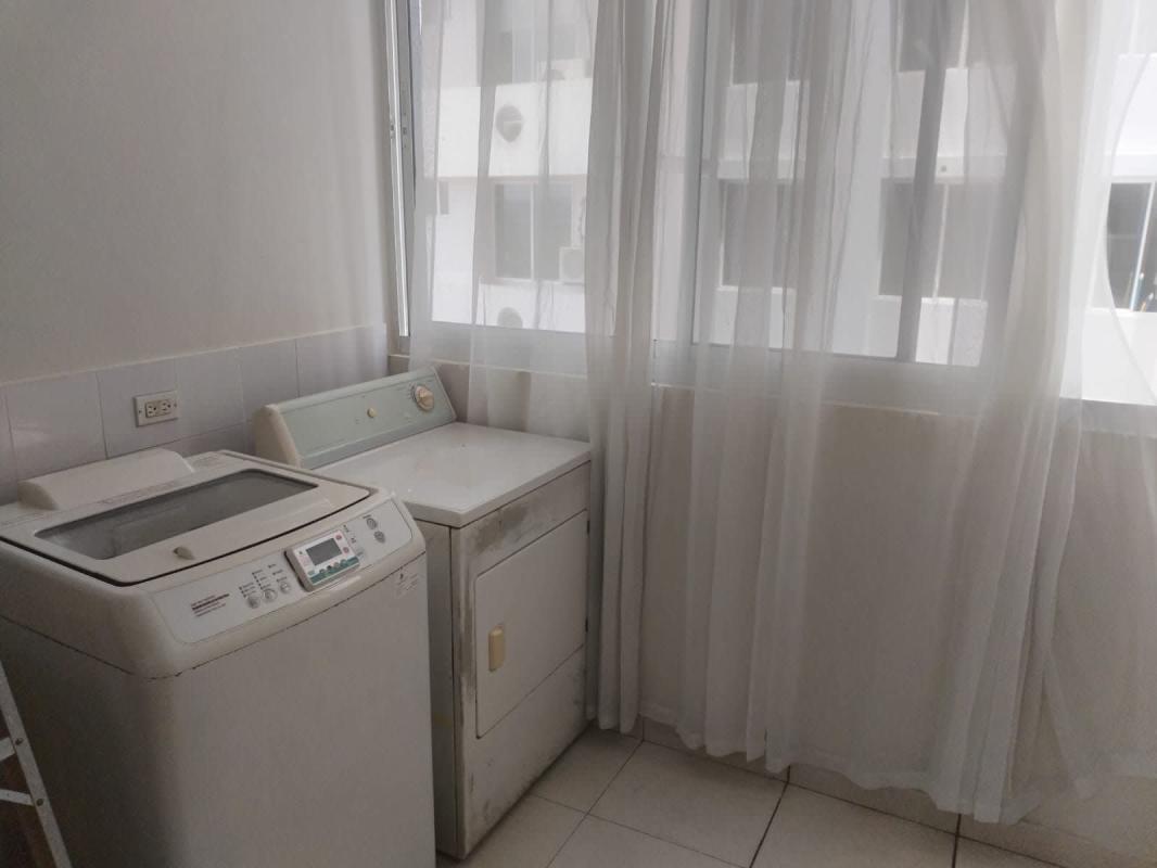 Laundry area with washer, dryer and window PH Aurora Tower El Cangrejo Panama
