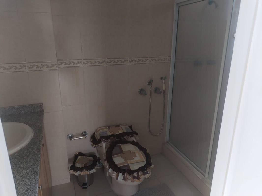 Bathroom with enclosed shower and granite counter PH Aurora Tower Panama