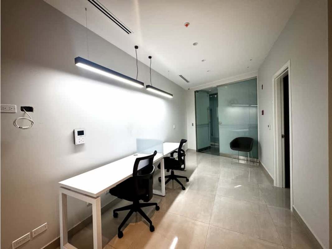 Furnished modern workspace with desks chairs glass divider PH Golden Point Panama