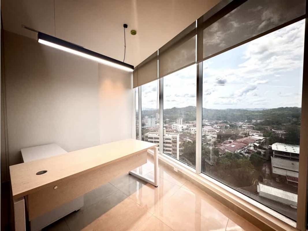 Private office space floor-to-ceiling windows view of Panama City skyline mountain backdrop