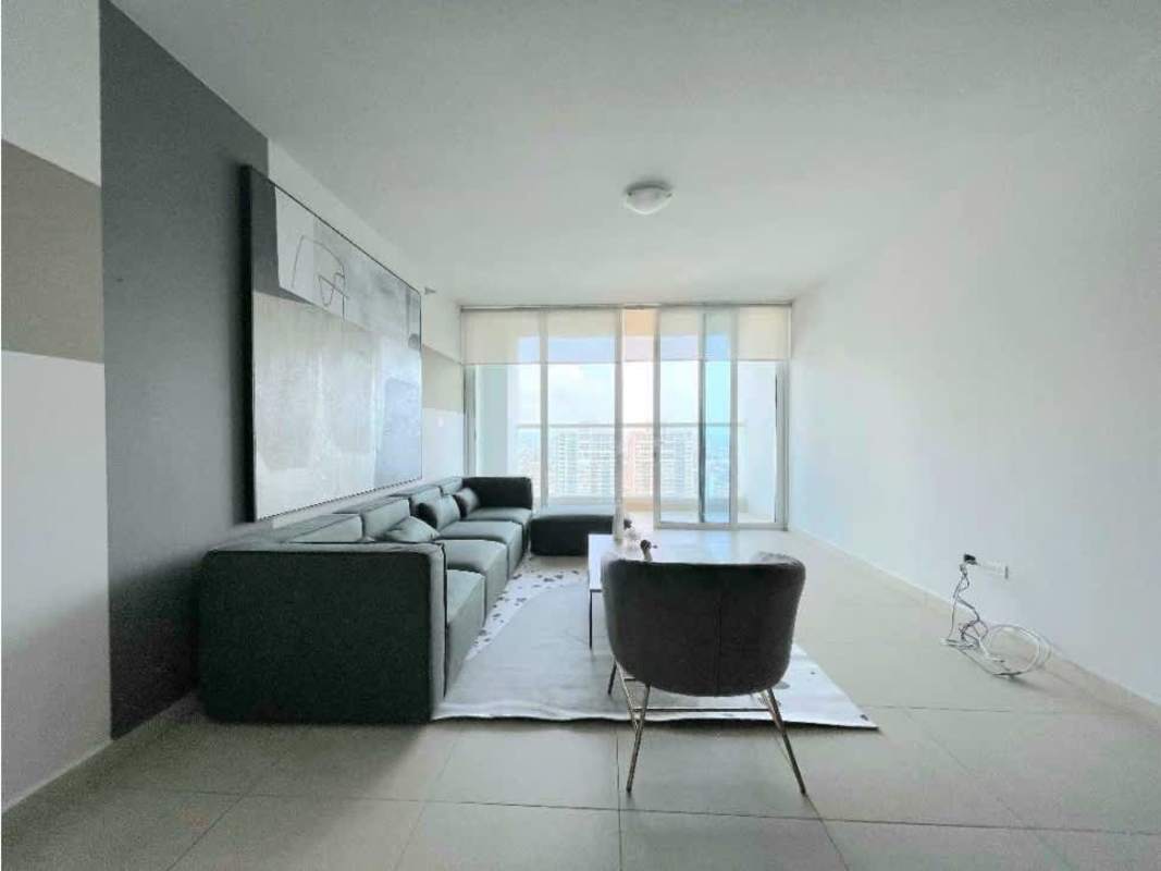 Formal dining with city views, modern lighting in luxury apartment Panama City