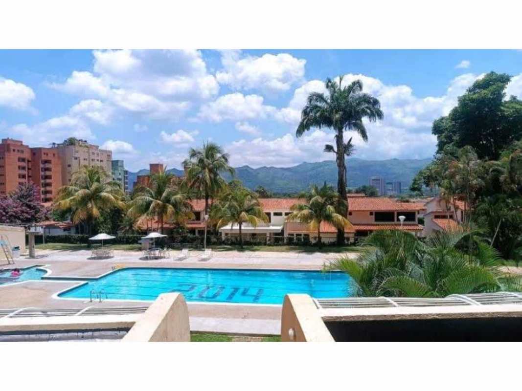 Outdoor pool with sun loungers next to tropical garden PH Park View Carrasquilla Panama City