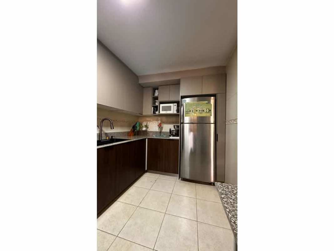 Modern kitchen with granite counters, appliances in Condado del Rey townhouse for rent