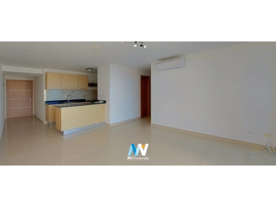 Open-plan living room with kitchen and air conditioning in Torres de Castilla apartment