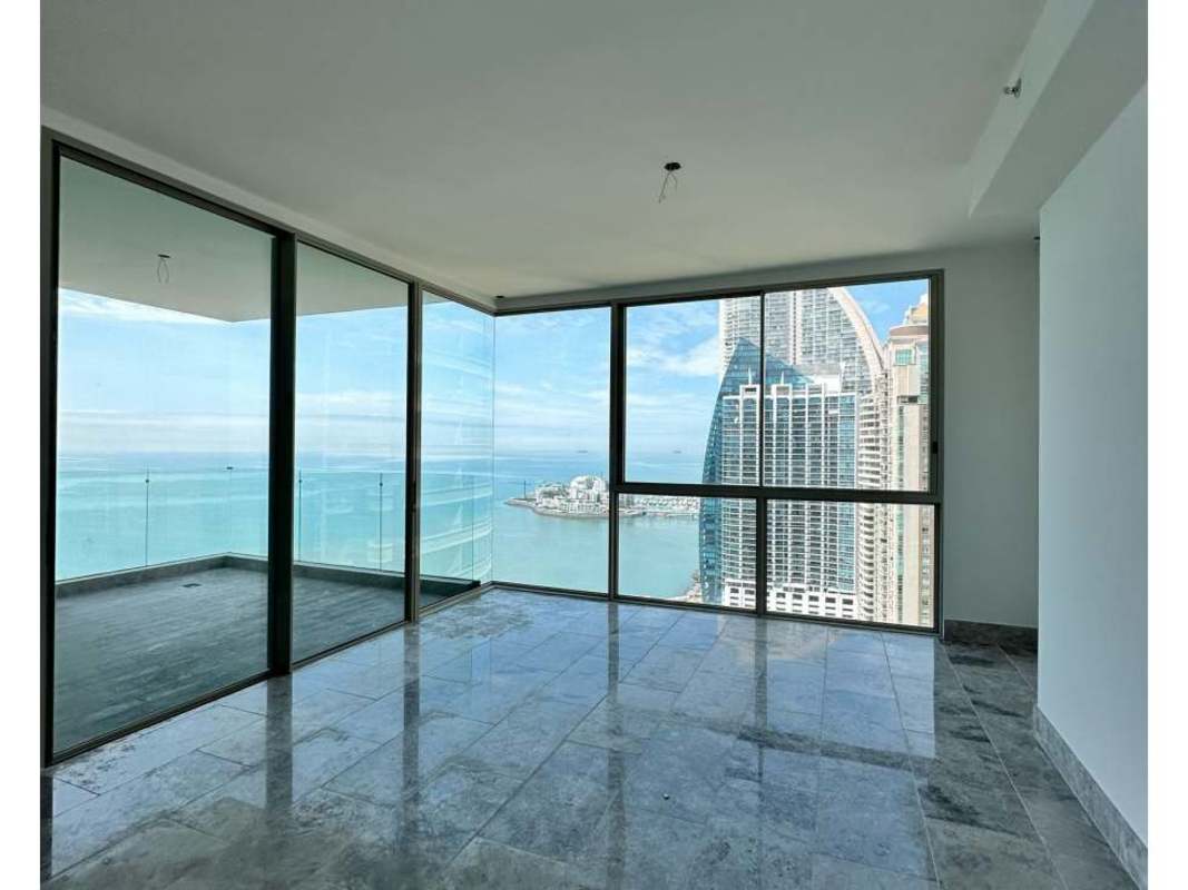 Modern living dining room floor-to-ceiling windows glass balcony ocean skyline view Punta Pacífica