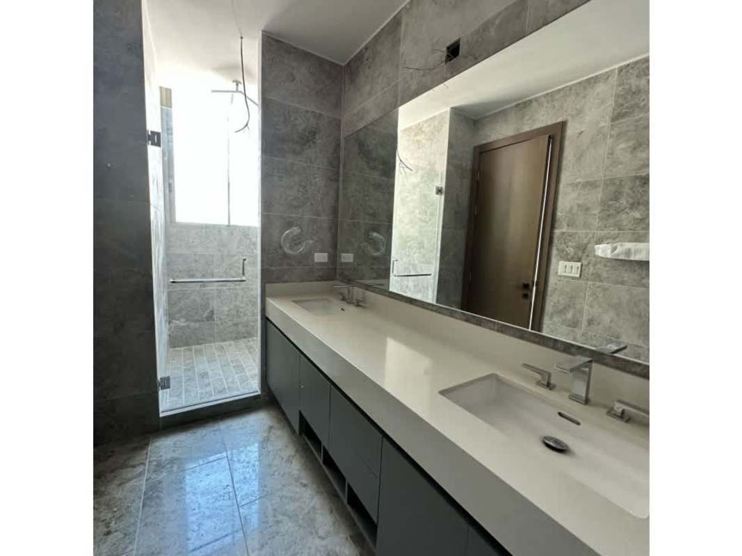 High-rise apartment living room with marble floor floor-to-ceiling windows panoramic ocean skyline views Pacific Point