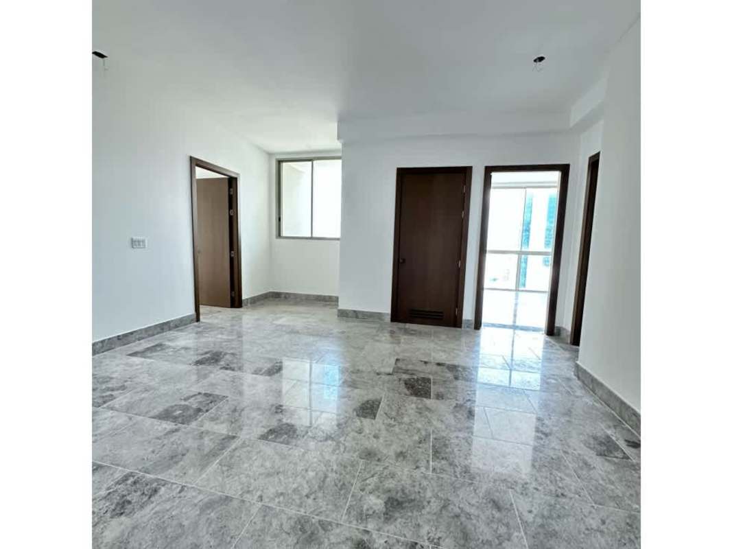 Interior hallway with marble floors white walls wooden trim in luxury condo Pacific Point
