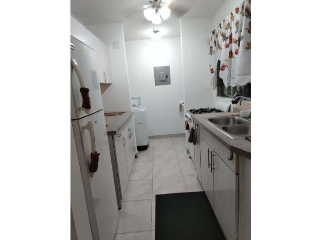 Equipped galley kitchen with tiled floor and double sink in PH Mystic Tower Rio Abajo Panama