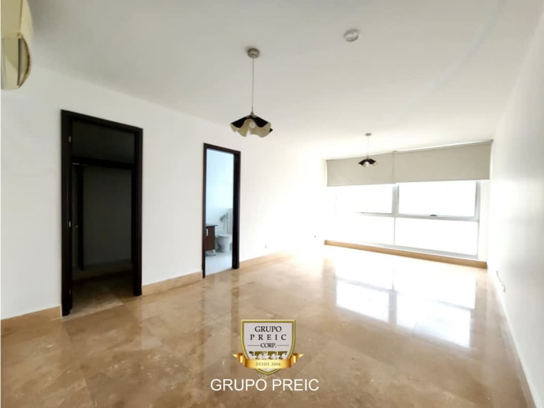 Bedroom with marble floors panoramic windows overlooking Pacific Ocean in Punta Pacifica PH Q Tower