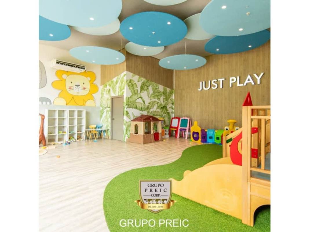 Indoor kids playroom with colorful murals and slides PH Country Club Costa del Este Panama