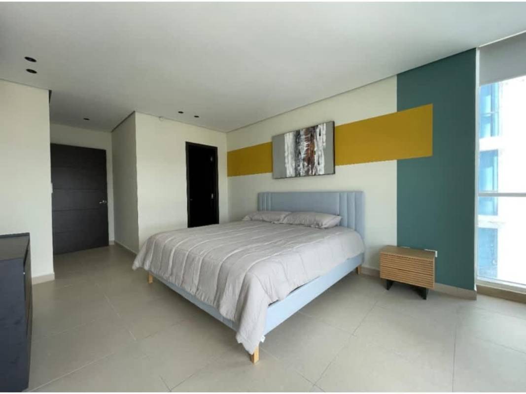 Bedroom with accent wall large window ceramic floors PH Country Club Costa del Este Panama