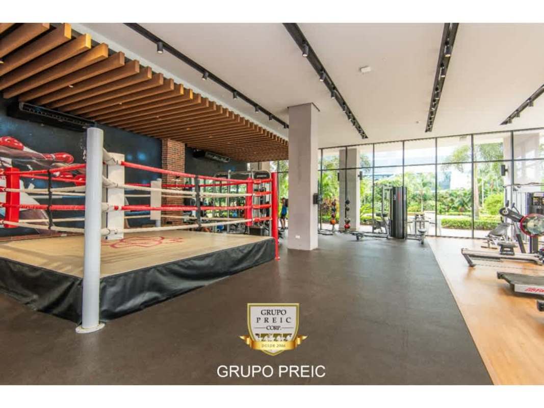 Modern gym area with boxing ring windows and mural PH Country Club Costa del Este Panama