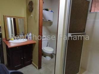 Beige bathroom with sink vanity, mirror, shower enclosure Lomas de Mastranto house for sale Panama