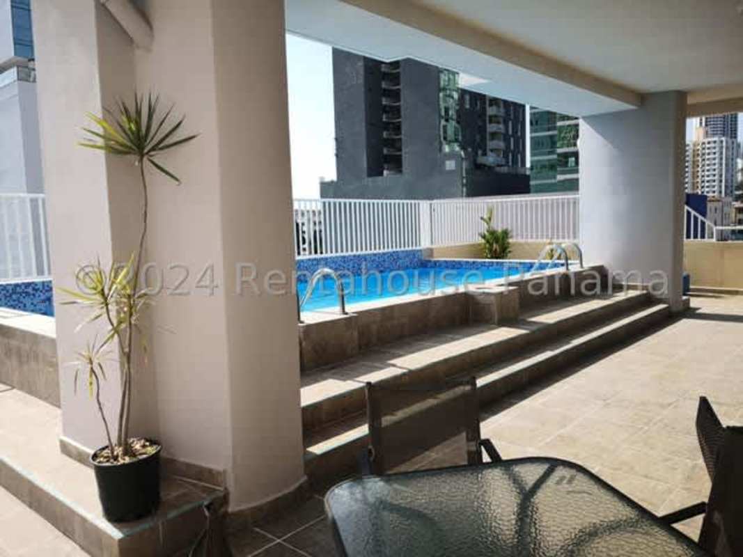 Dining room with blue accent wall and AC San Francisco Panama apartment