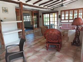 Rustic living room with wood beams tiled floors Coronado Panama