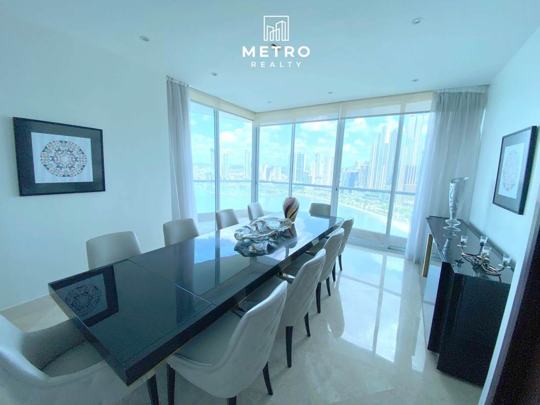 Curved oceanfront balcony with glass railing panoramic Pacific view in The Point Panama