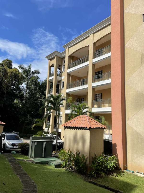 Kitchen with granite countertops, stove, microwave, washing machine in Albrook Park Panama