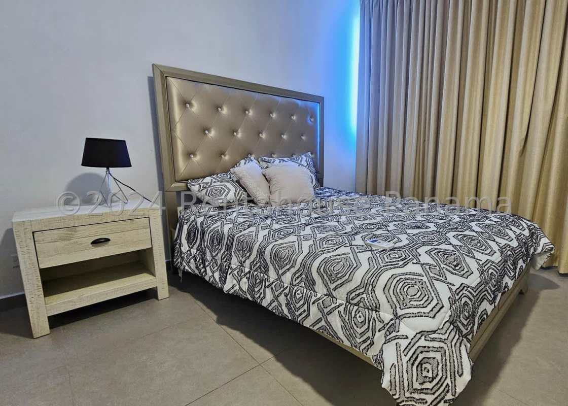 Modern bedroom with tile floors, large windows, and skyline views at PH La Cresta Bella Vista