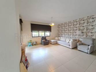 Spacious bright living room with modern decor and balcony access at PH River Valley Panama Pacifico