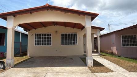 One-story suburban house with front porch, covered parking and barred windows in Brisas del Golf Arraijan Panama