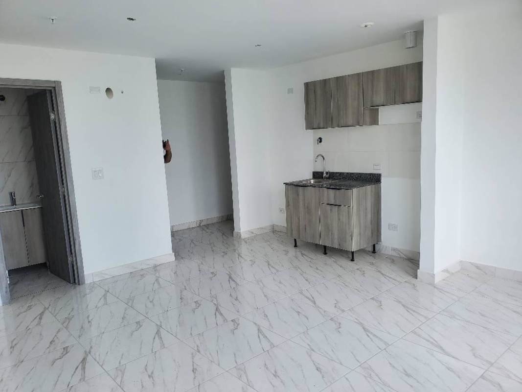 Open-plan studio apartment with tile flooring PH The Gray Panama Real Estate