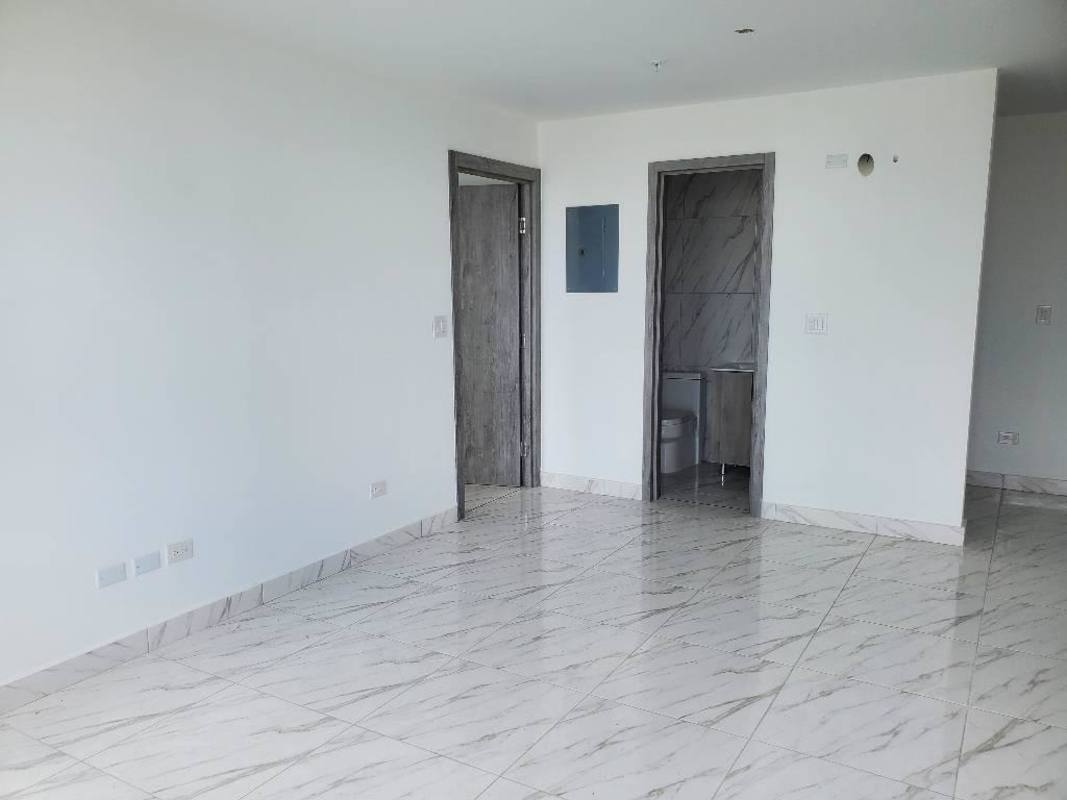 Bright living room huge city view windows tile floors PH The Gray Obarrio Panama