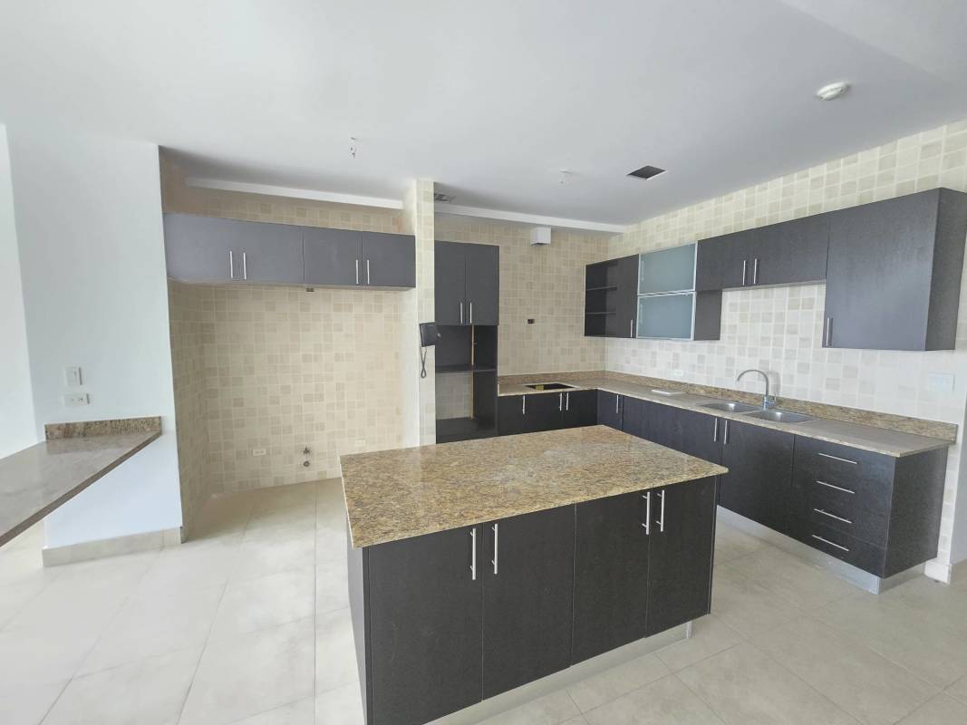 Kitchen featuring granite countertops, island and appliances at Amador Heights Panama