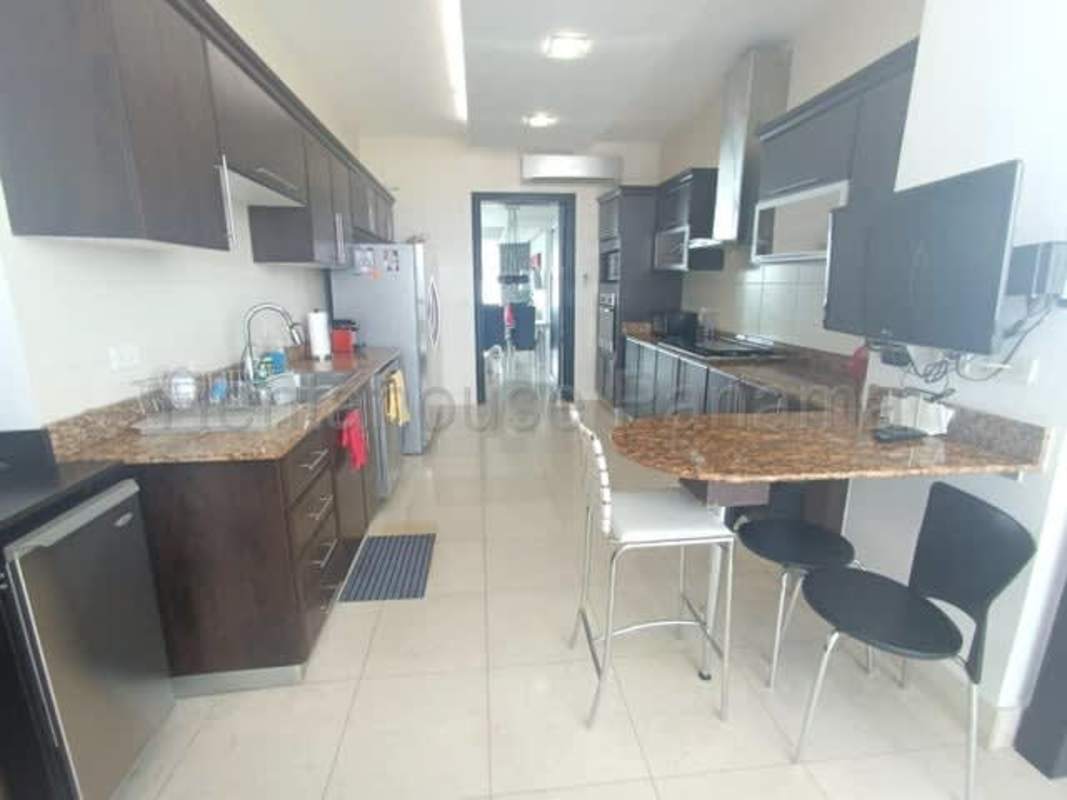 Modern dining room with marble floors, large windows and panoramic view at PH Mirador Costa del Este Panama City