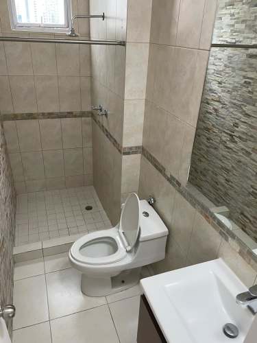 Bright living and dining room with floor-to-ceiling windows PH Jardines Costa del Este Panama City