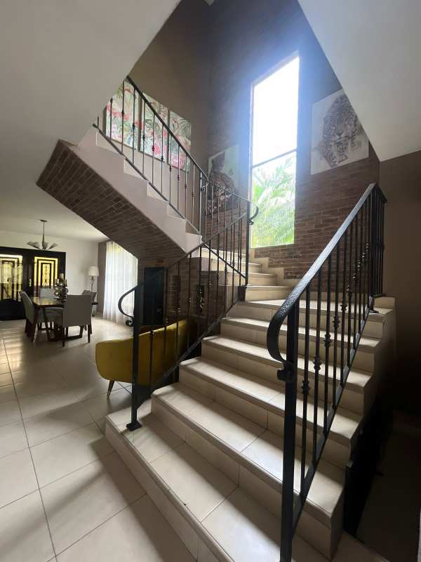 Open-plan living dining area with staircase, modern decor in Paseo Dorado Condado del Rey Panama