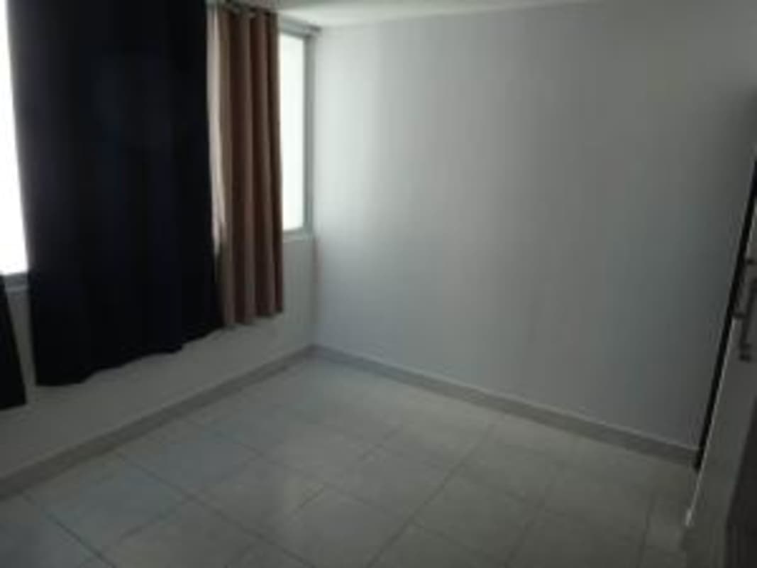Contemporary bathroom with glass shower enclosure in Edison Park apartment Panama