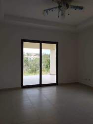 Living area with large sliding doors overlooking garden beach property Panama