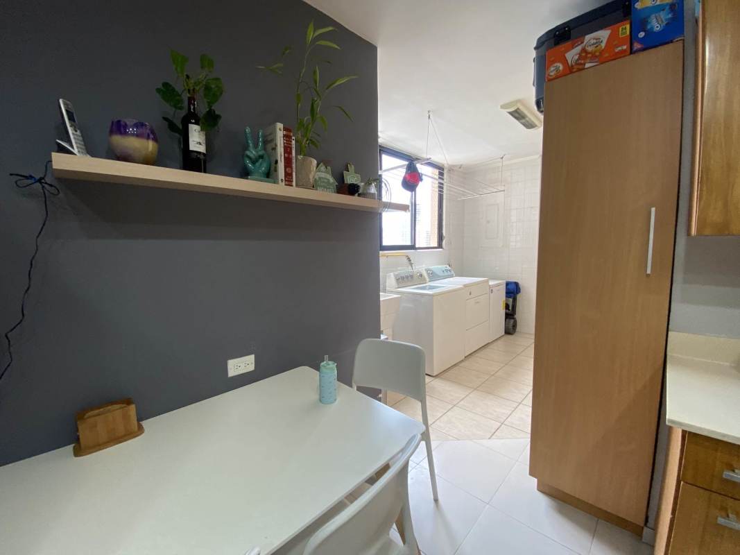 Kitchen with natural stone counters, wood cabinetry PH Luna del Mar Coco del Mar Panama