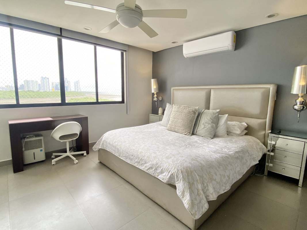 Second bedroom with built-in closet, air conditioner, plenty of light at Luna del Mar Coco del Mar