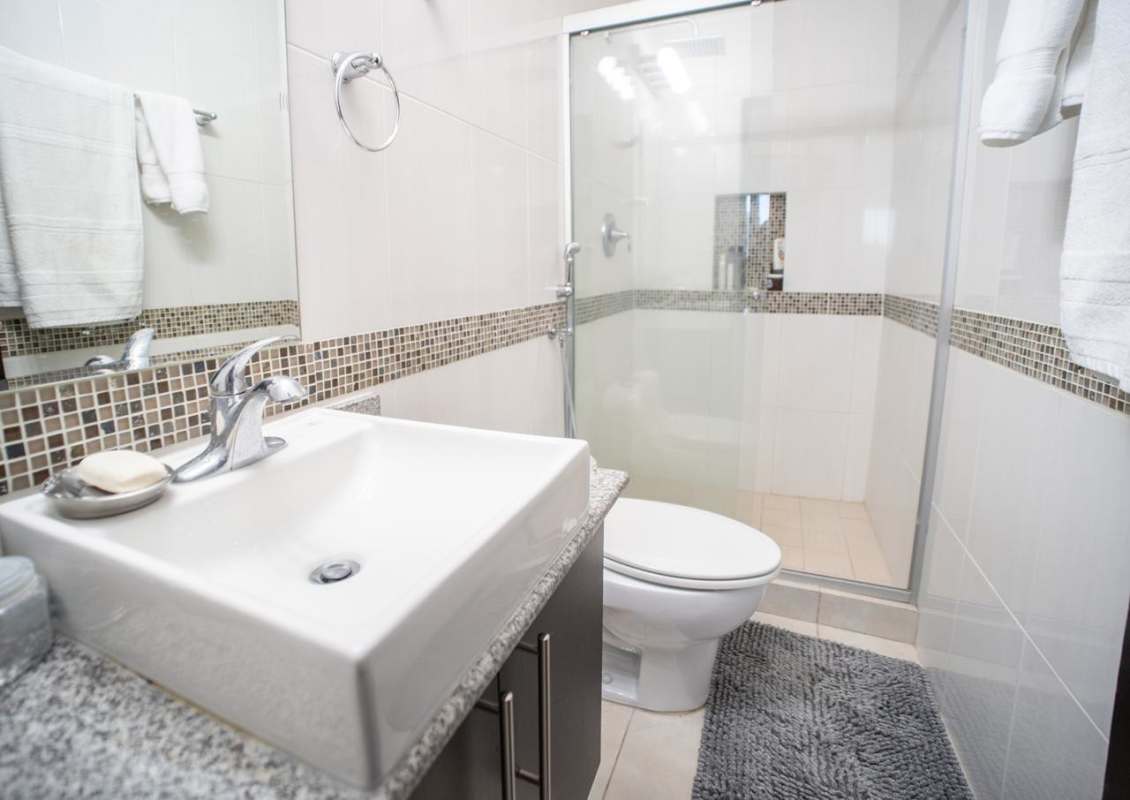 Spacious living and dining room with access to balcony and views at Edison Park Panama