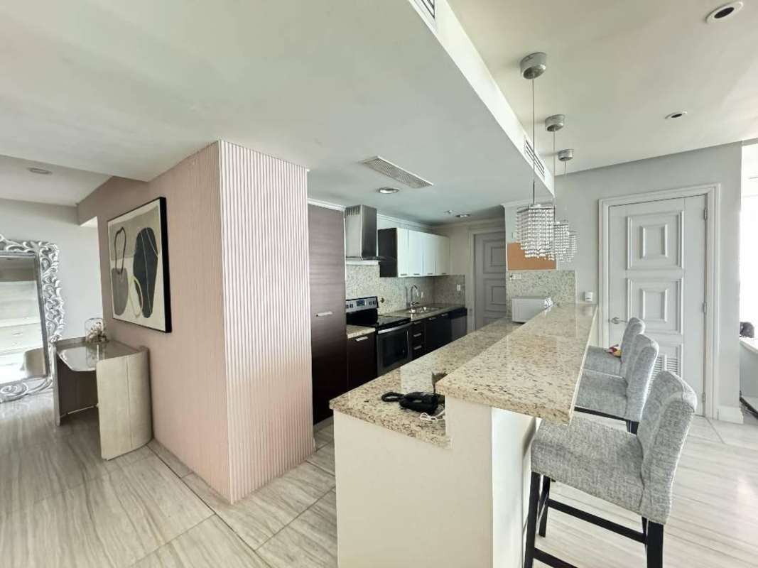 Modern dining area with panoramic sea view windows in Trump Ocean Club Panama City