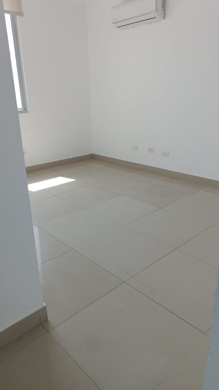 Bedroom with large window and ocean view in PH Costamare apartment Costa del Este Panama